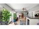 Spacious sunroom with bright, airy design, potted plants, and transition to the kitchen at 6421 Calusa Dr, Lakeland, FL 33813