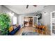 Bright living area with tile floors, access to other rooms, and comfortable seating at 6421 Calusa Dr, Lakeland, FL 33813