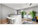 Stylish living area with indoor plants, and bar, creating a tranquil and inviting space at 6421 Calusa Dr, Lakeland, FL 33813