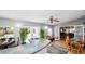 Inviting living area featuring a bar, indoor plants, and access to multiple rooms at 6421 Calusa Dr, Lakeland, FL 33813