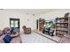 Spacious living room featuring neutral paint, tile floors, and an open layout to the backyard at 6421 Calusa Dr, Lakeland, FL 33813