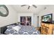 Comfortable main bedroom featuring carpet floors, a ceiling fan, and a closet at 6421 Calusa Dr, Lakeland, FL 33813