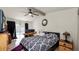 Comfortable main bedroom featuring carpet floors, a ceiling fan, and an outdoor view to the pool at 6421 Calusa Dr, Lakeland, FL 33813