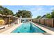 Backyard pool view featuring a patio with a grill and outdoor seating at 6421 Calusa Dr, Lakeland, FL 33813