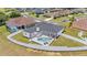 Aerial view of the house showing a fenced in yard and screened in swimming pool at 6707 Hillis Dr, Lakeland, FL 33813