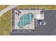 An aerial perspective showcases a screened pool within a fenced backyard at 6707 Hillis Dr, Lakeland, FL 33813