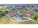 Aerial view of neighborhood with screened pool and fenced-in yard at 6707 Hillis Dr, Lakeland, FL 33813