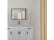 Bright bathroom with quartz countertops, shaker cabinets, and brass fixtures at 6707 Hillis Dr, Lakeland, FL 33813