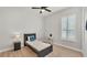 Bedroom featuring a ceiling fan, wood floors, and lots of natural light at 6707 Hillis Dr, Lakeland, FL 33813