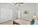 Bedroom featuring a ceiling fan, wood floors, closet, and doorway at 6707 Hillis Dr, Lakeland, FL 33813