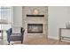 Close up on the modern stone fireplace with hearth and decor in a bright living room at 6707 Hillis Dr, Lakeland, FL 33813