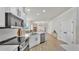 Open-concept kitchen with a large island, stainless steel appliances and a view into the living room at 6707 Hillis Dr, Lakeland, FL 33813