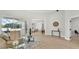 Open-concept living room with access to the pool and dining area at 6707 Hillis Dr, Lakeland, FL 33813