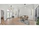 Bright living room with high ceilings, wood floors, and arched doorways at 6707 Hillis Dr, Lakeland, FL 33813