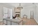 Cozy living room features a stone fireplace, modern decor, and lots of natural light at 6707 Hillis Dr, Lakeland, FL 33813