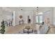 Spacious living room with high ceilings, wood floors, and a view of the kitchen at 6707 Hillis Dr, Lakeland, FL 33813