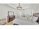 Bright main bedroom with light wood floors and ensuite bathroom access at 6707 Hillis Dr, Lakeland, FL 33813