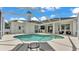 The screened pool with ample patio space, bar seating and room for entertaining at 6707 Hillis Dr, Lakeland, FL 33813