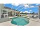 Relax in this screened pool with deck seating, patio and backyard at 6707 Hillis Dr, Lakeland, FL 33813