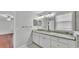 Bright bathroom with marble countertop vanity and double sinks at 6964 Lake Eaglebrooke Dr, Lakeland, FL 33813