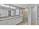 Bathroom with double sink vanity, granite countertops, and glass shower at 6964 Lake Eaglebrooke Dr, Lakeland, FL 33813