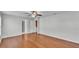 Spacious bedroom featuring hardwood floors, ceiling fan and ensuite bathroom at 6964 Lake Eaglebrooke Dr, Lakeland, FL 33813