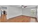 Bright and airy bedroom with hardwood floors, ceiling fan and access to the kitchen at 6964 Lake Eaglebrooke Dr, Lakeland, FL 33813