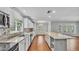 Spacious kitchen with stone countertops, stainless appliances, and center island at 6964 Lake Eaglebrooke Dr, Lakeland, FL 33813