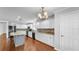 Bright kitchen with stainless steel appliances, custom backsplash, and large center island at 6964 Lake Eaglebrooke Dr, Lakeland, FL 33813