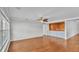 Living room area featuring decorative wood paneling and hardwood floors at 6964 Lake Eaglebrooke Dr, Lakeland, FL 33813