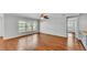 Bright open concept living room with large windows and hardwood floors at 6964 Lake Eaglebrooke Dr, Lakeland, FL 33813