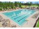 A large community swimming pool with lounge chairs, provides residents with a relaxing space for recreation and leisure at 6964 Lake Eaglebrooke Dr, Lakeland, FL 33813