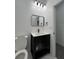 Bathroom featuring modern vanity, white countertop, and decorative mirror at 801 Robson W St, Lakeland, FL 33805