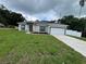 Charming single-story home with a well-manicured lawn and paved driveway at 801 Robson W St, Lakeland, FL 33805