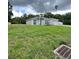 New construction, single-story home featuring a large front yard at 801 Robson W St, Lakeland, FL 33805