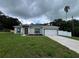 Charming single-story home with a well-manicured lawn and two-car garage at 801 Robson W St, Lakeland, FL 33805