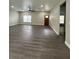 Open floor plan living room with modern gray flooring and recessed lighting at 801 Robson W St, Lakeland, FL 33805