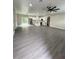 Open-concept living room with recessed lighting, fan, and sliding glass doors at 801 Robson W St, Lakeland, FL 33805