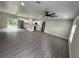 A contemporary living space features recessed lighting, a fan, and a seamless flow to the kitchen at 801 Robson W St, Lakeland, FL 33805