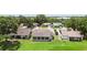 Aerial view of a home with a large backyard, mature trees, and a screened-in porch at 849 Rockingham Rd, Lakeland, FL 33809