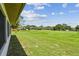 Large, expansive backyard with a lush lawn, offering plenty of space and privacy at 849 Rockingham Rd, Lakeland, FL 33809