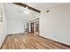 Spacious main bedroom with wood floors, fan, and multiple entryways at 849 Rockingham Rd, Lakeland, FL 33809