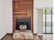 Close-up of fireplace with unique wood paneling and stone base at 849 Rockingham Rd, Lakeland, FL 33809