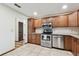 Bright kitchen featuring wooden cabinets and stainless steel appliances at 849 Rockingham Rd, Lakeland, FL 33809