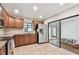 Well-lit kitchen with wooden cabinets and direct access to the hot tub at 849 Rockingham Rd, Lakeland, FL 33809