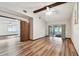Living room boasting vaulted ceilings, wood floors and sliders to the lanai at 849 Rockingham Rd, Lakeland, FL 33809