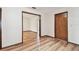 Living room featuring wood floors and an open doorway to another room at 849 Rockingham Rd, Lakeland, FL 33809