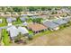 Aerial view of a suburban neighborhood with well-maintained houses and lawns at 9017 Se 119Th St, Summerfield, FL 34491