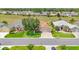 Aerial view of the home showing landscaping, driveway, lawn, and relation to neighboring houses at 9017 Se 119Th St, Summerfield, FL 34491