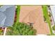 Top down aerial view of the roof with tree, manicured lawns, and neighboring house at 9017 Se 119Th St, Summerfield, FL 34491